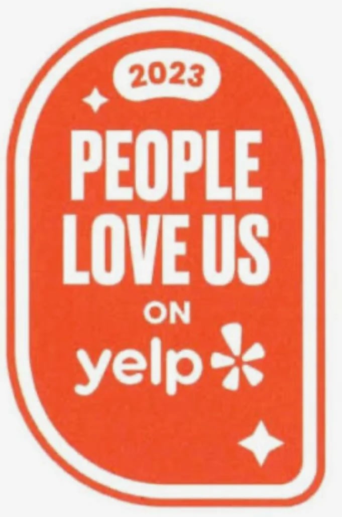 2023 Yelp award badge with text People Love Us on Yelp in white on red background